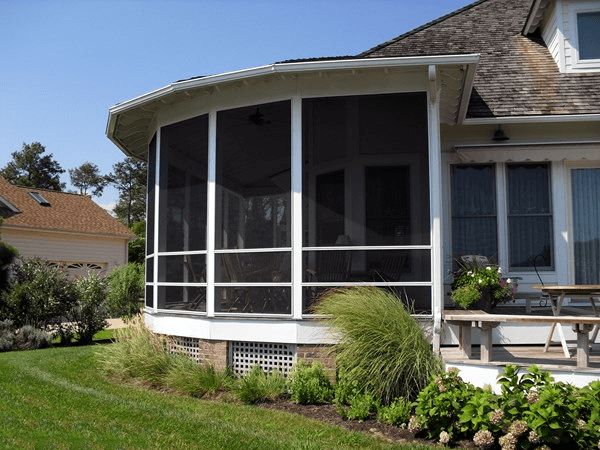 A curved screened in patio offers a wider viewing area and a unique look to a home.