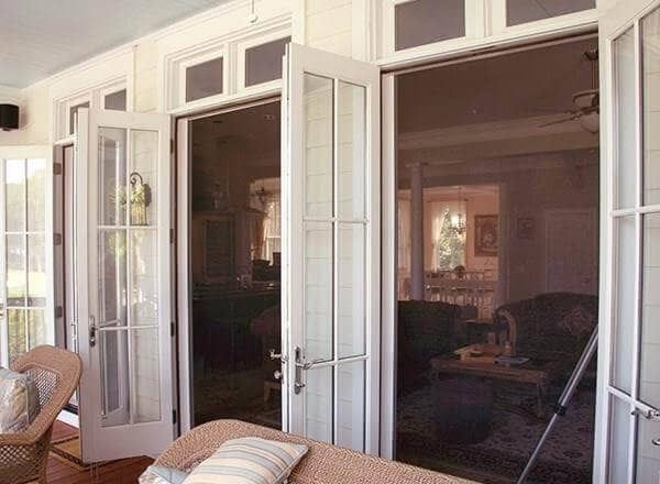 Side by side French doors with retractable screens. 