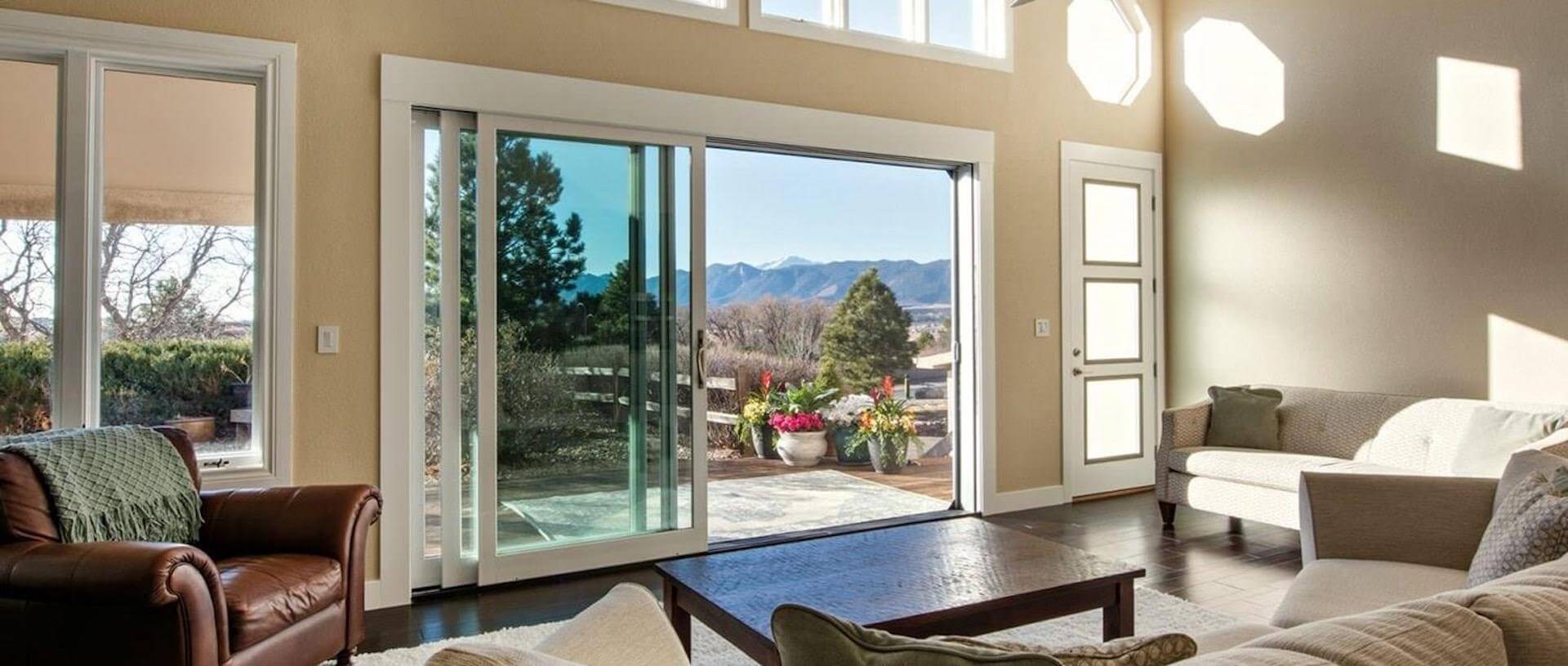 Back screen doors opens out to a porch and beautiful scenery