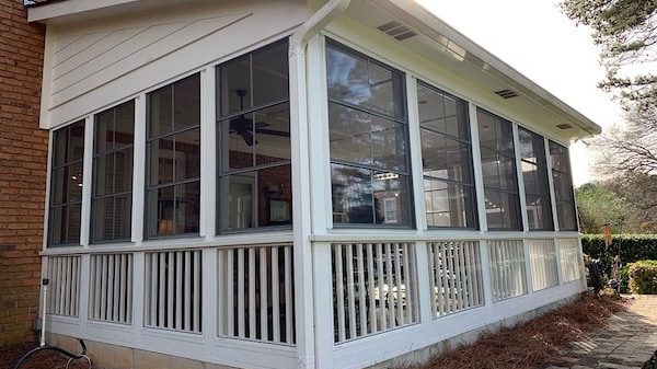 Low maintenance sunroom conversion for a porch